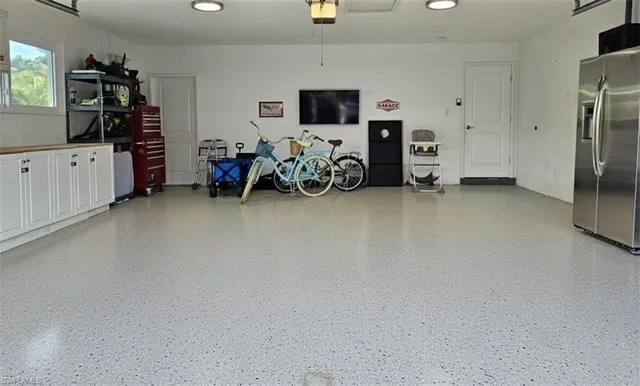 a view of a livingroom with furniture and a flat screen tv