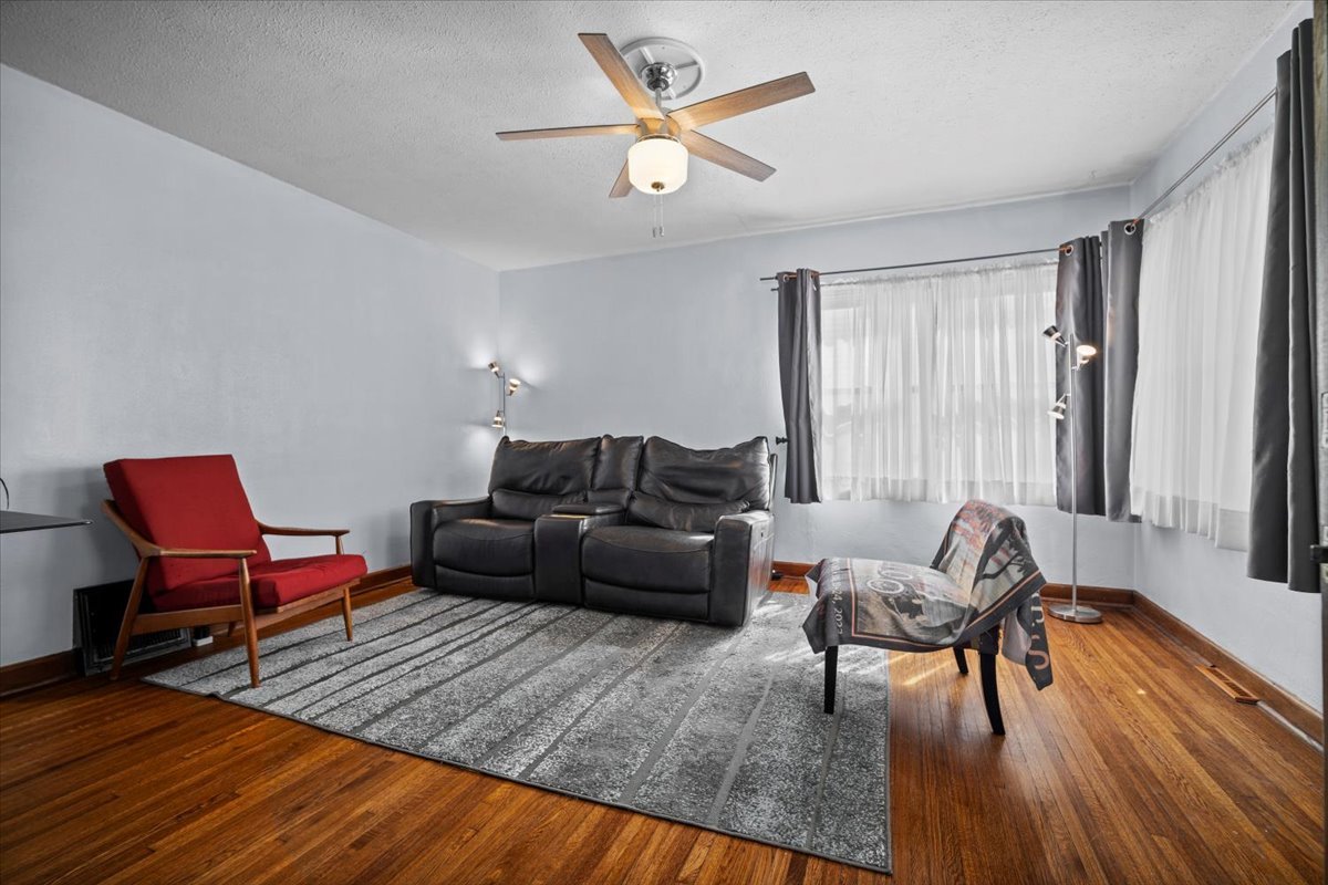 914 Normal Avenue Normal, IL 61761 - Photo 14 of 23 a living room with furniture and a wooden floor