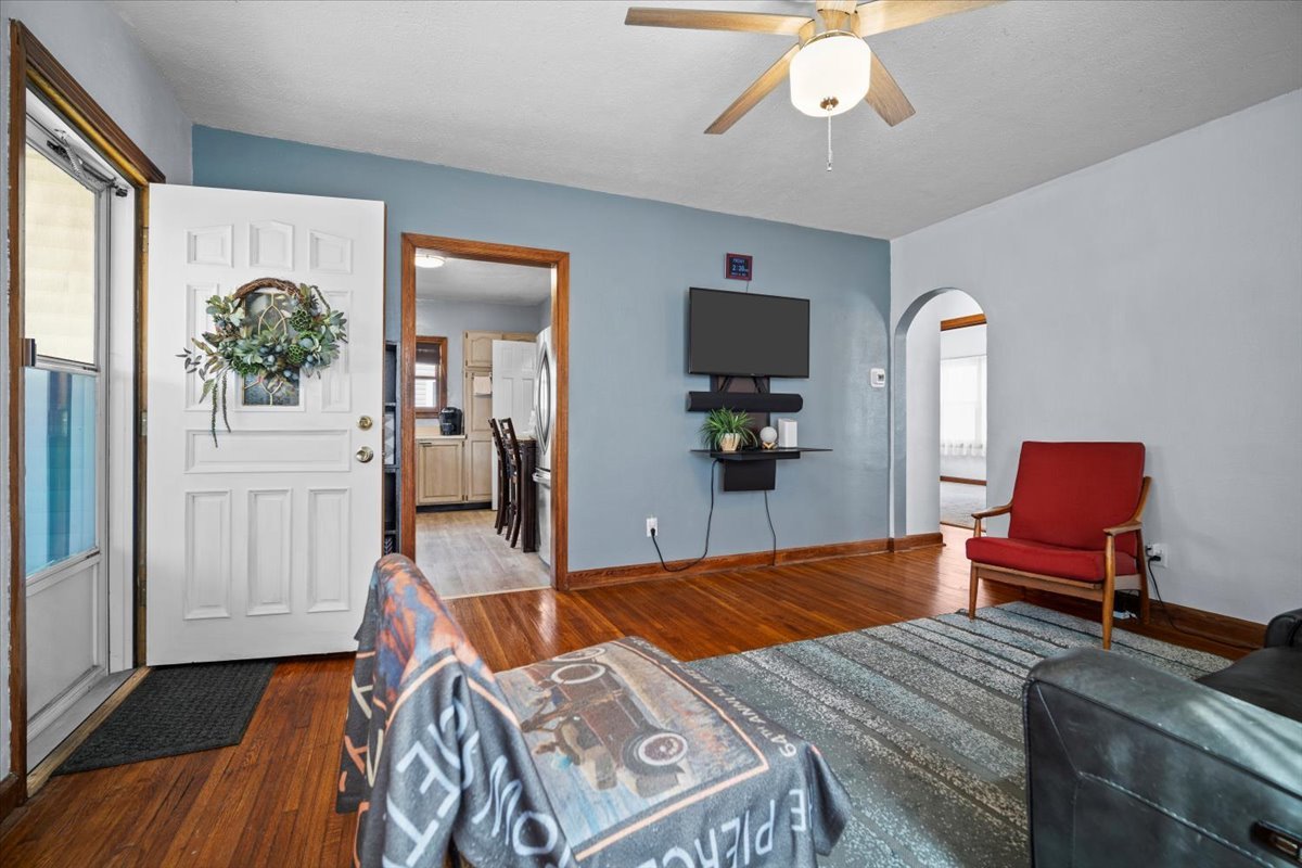 914 Normal Avenue Normal, IL 61761 - Photo 4 of 23 a bedroom with a bed and a chandelier