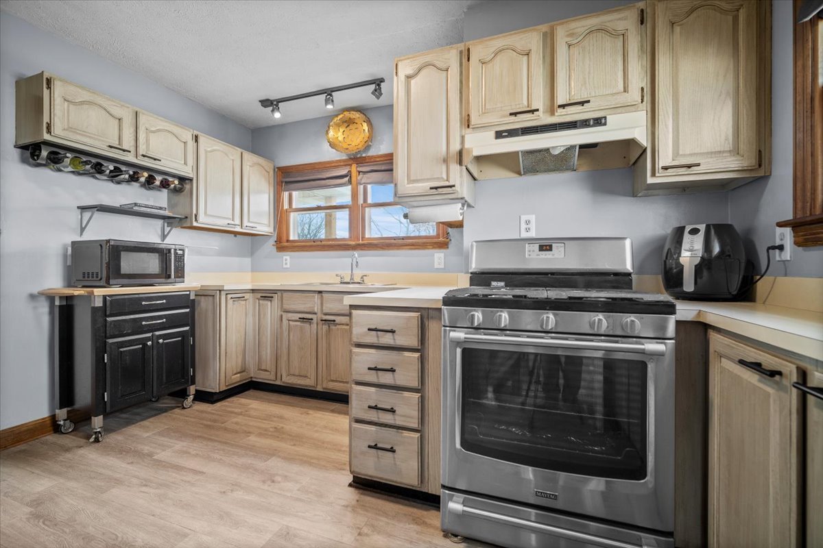 914 Normal Avenue Normal, IL 61761 - Photo 7 of 23 a kitchen with stainless steel appliances granite countertop a stove and a sink
