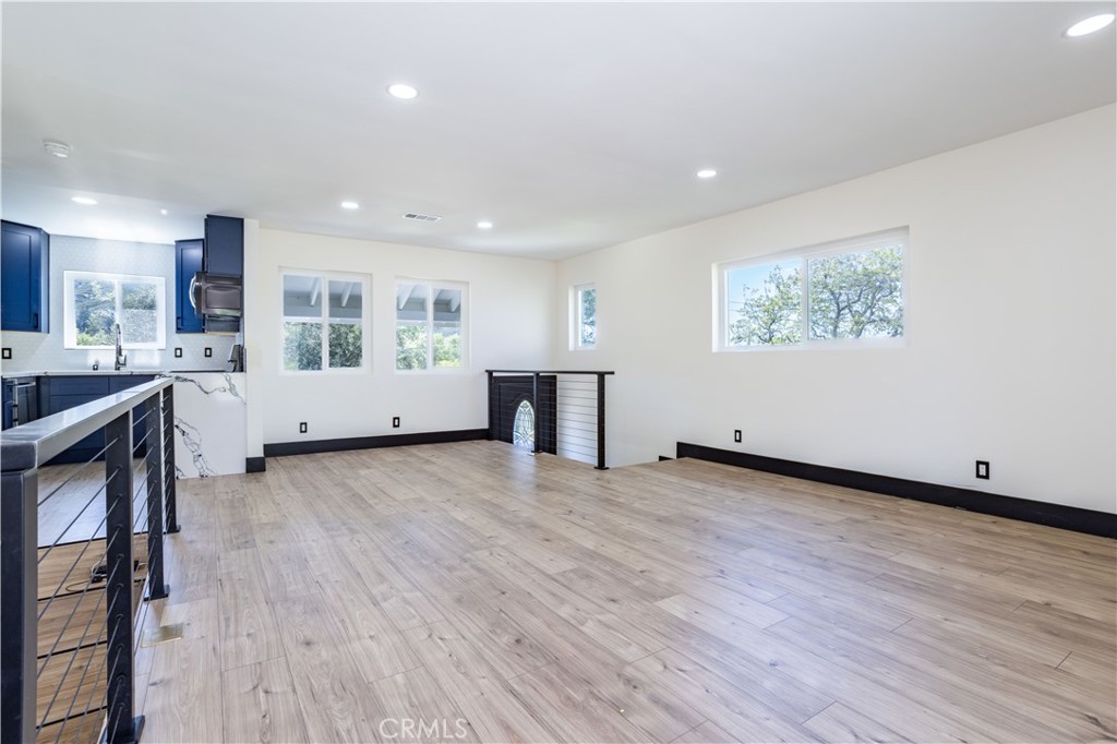 42640 Ranch Club Road Lake Hughes, CA 93532 - Photo 5 of 27 a view of a kitchen with furniture and wooden floor