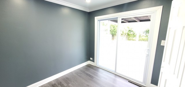 329 Fletcher Drive Wheeling, IL 60090 - Photo 10 of 16 a view of a small space with wooden floor and a window