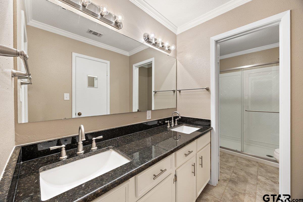 133 Caroline Street Rusk, TX 75785 - Photo 14 of 21 a bathroom with a granite countertop sink and a mirror