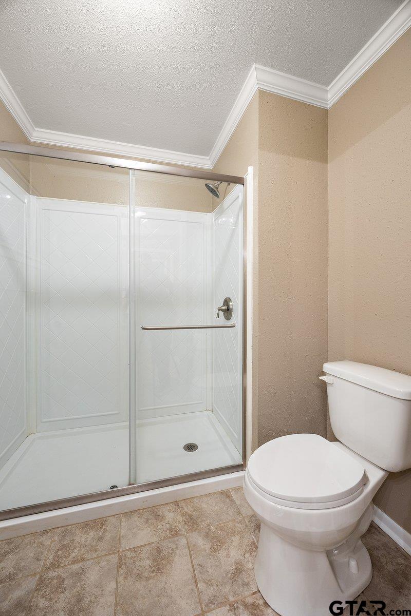 133 Caroline Street Rusk, TX 75785 - Photo 15 of 21 a bathroom with a shower and a toilet