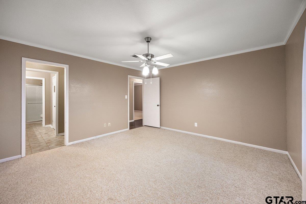 133 Caroline Street Rusk, TX 75785 - Photo 16 of 21 a view of an empty room with a ceiling fan