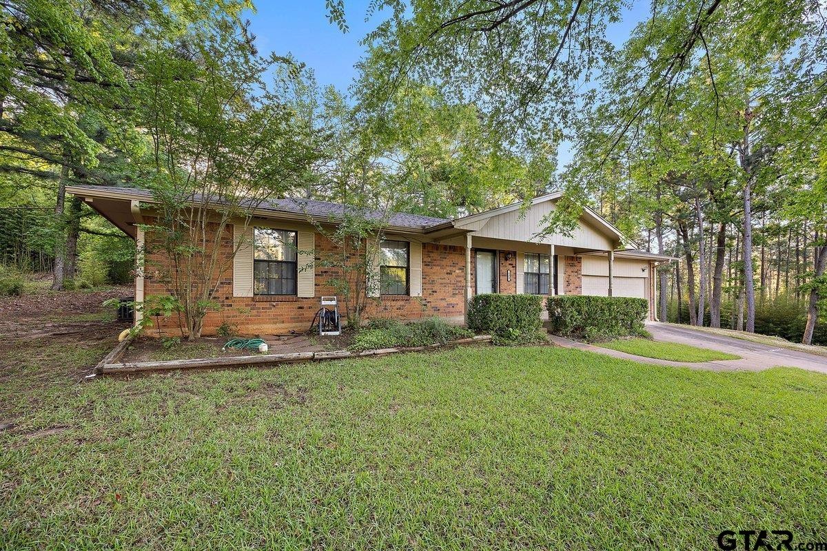 133 Caroline Street Rusk, TX 75785 - Photo 3 of 21 a front view of a house with a yard