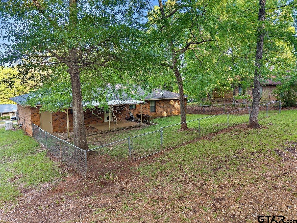133 Caroline Street Rusk, TX 75785 - Photo 4 of 21 a view of house with outdoor space and garden