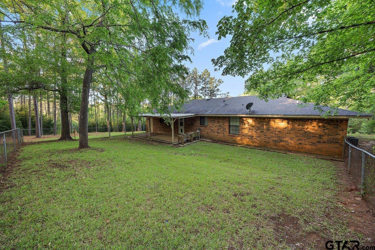 133 Caroline Street Rusk, TX 75785 - Photo 5 of 21 a view of a house with backyard and sitting area