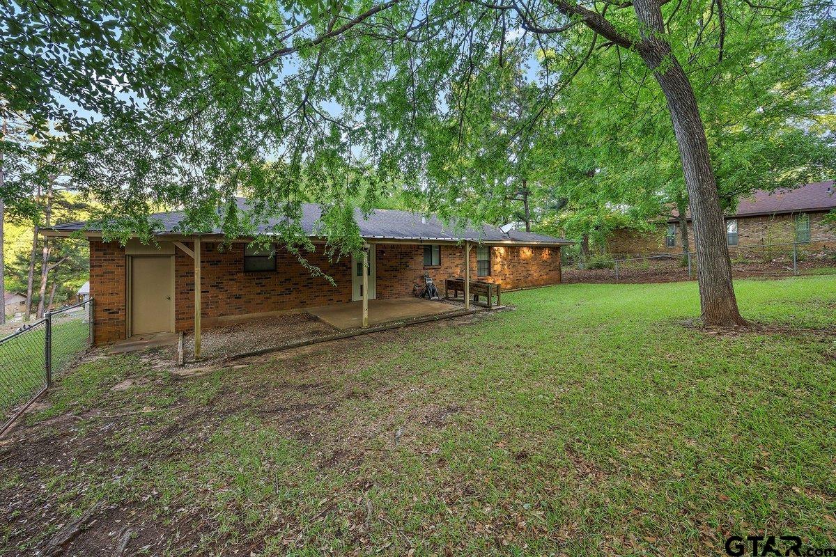 133 Caroline Street Rusk, TX 75785 - Photo 6 of 21 front view of a house with a yard
