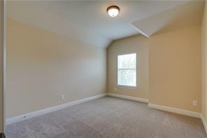4679 Edith Street Plano, TX 75024 - Photo 28 of 34 Carpeted room with a single window, sloped ceiling detail, and recessed lighting