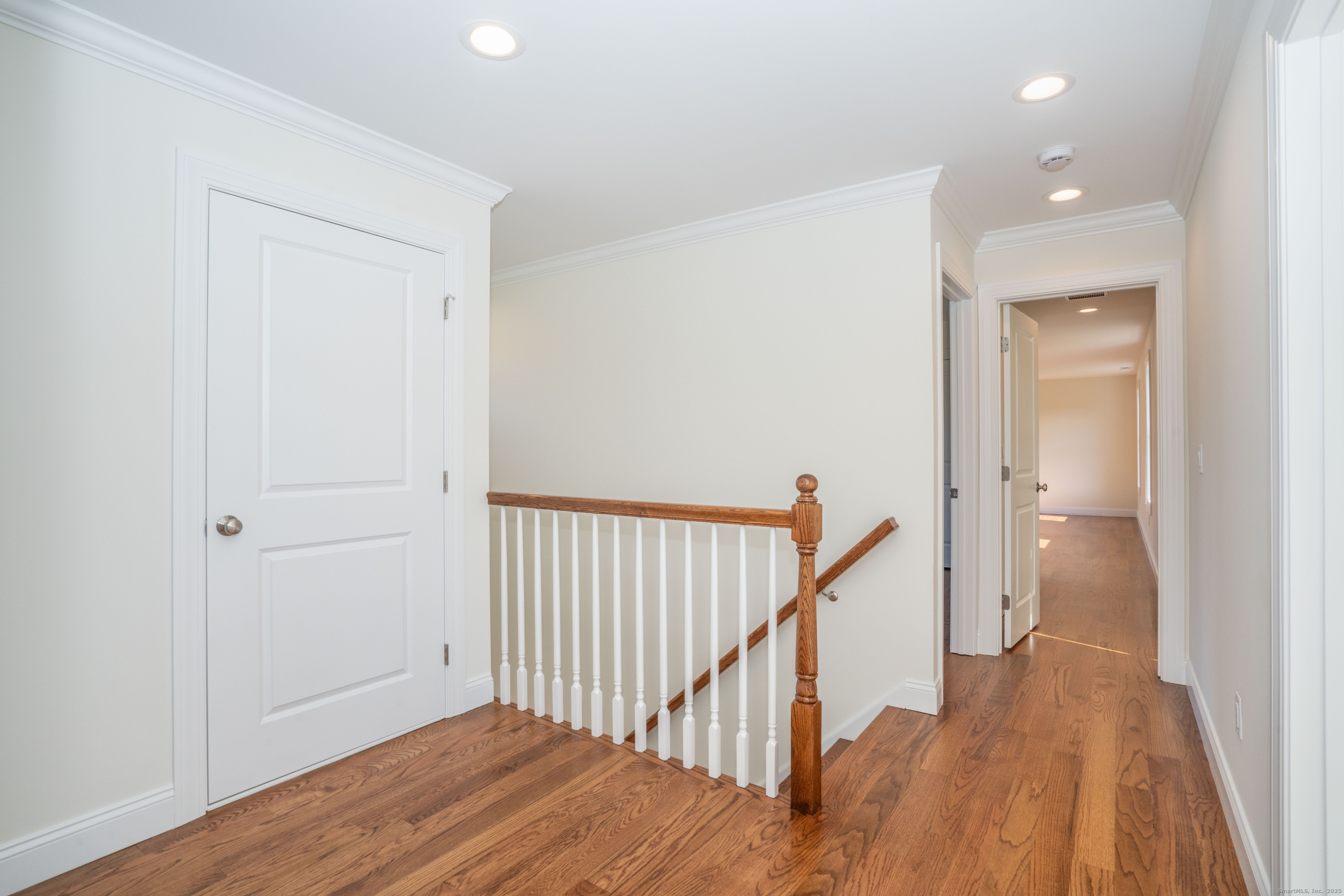 975 High Road Berlin, CT 06037 - Photo 14 of 35 a view of a hallway with wooden floor and staircase