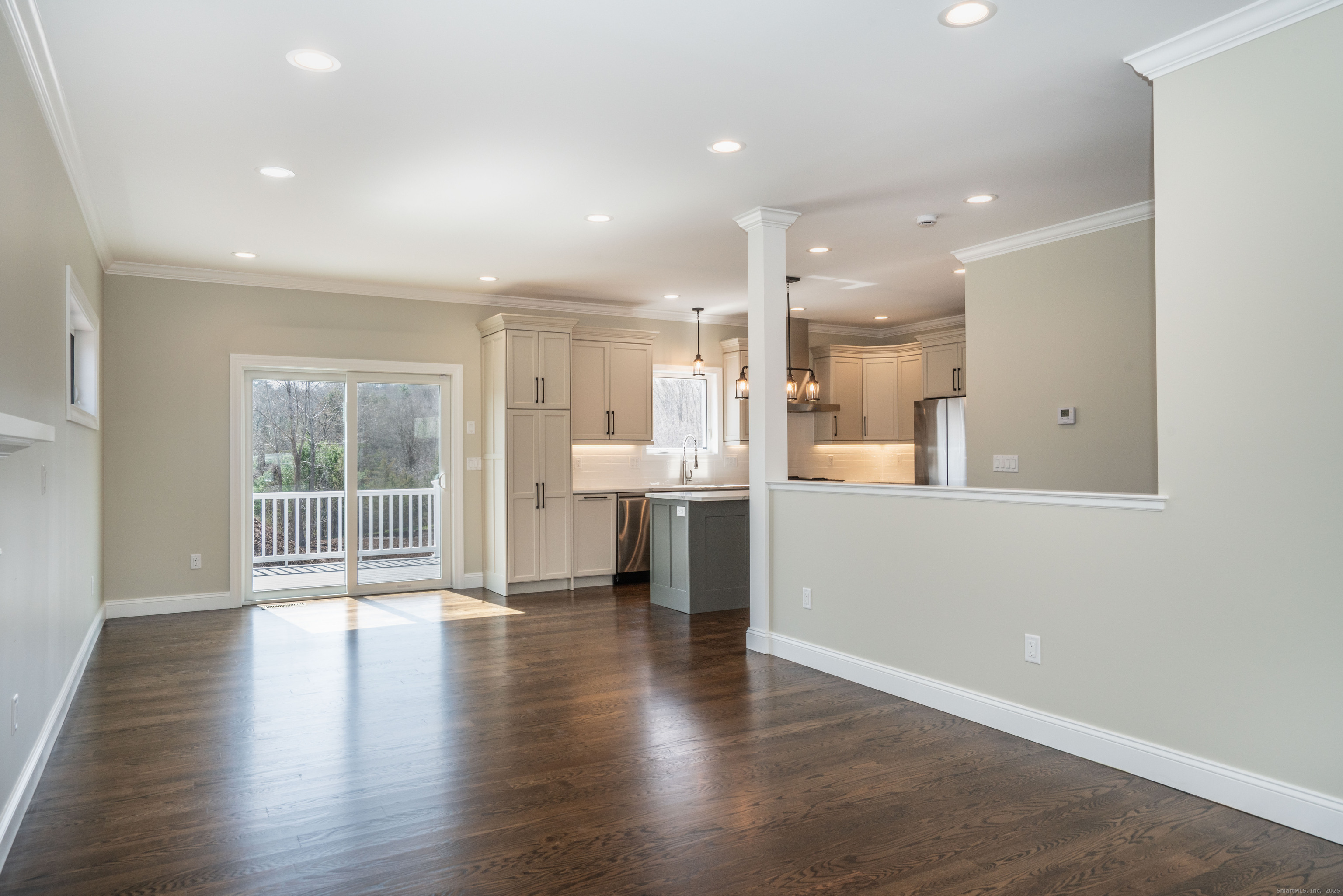 975 High Road Berlin, CT 06037 - Photo 22 of 34 an open kitchen with white cabinets and wooden floor