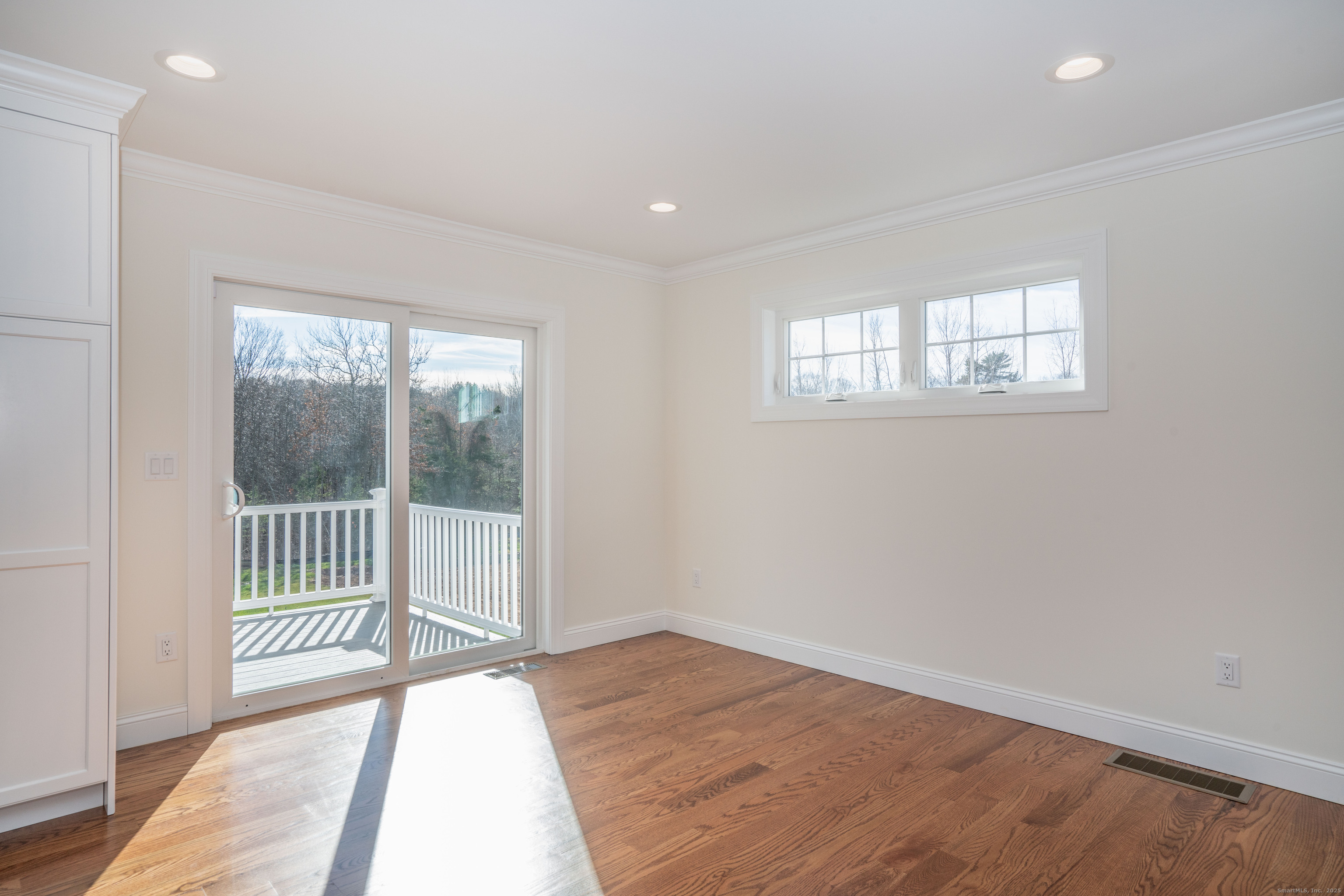975 High Road Berlin, CT 06037 - Photo 26 of 35 an empty room with wooden floor and windows