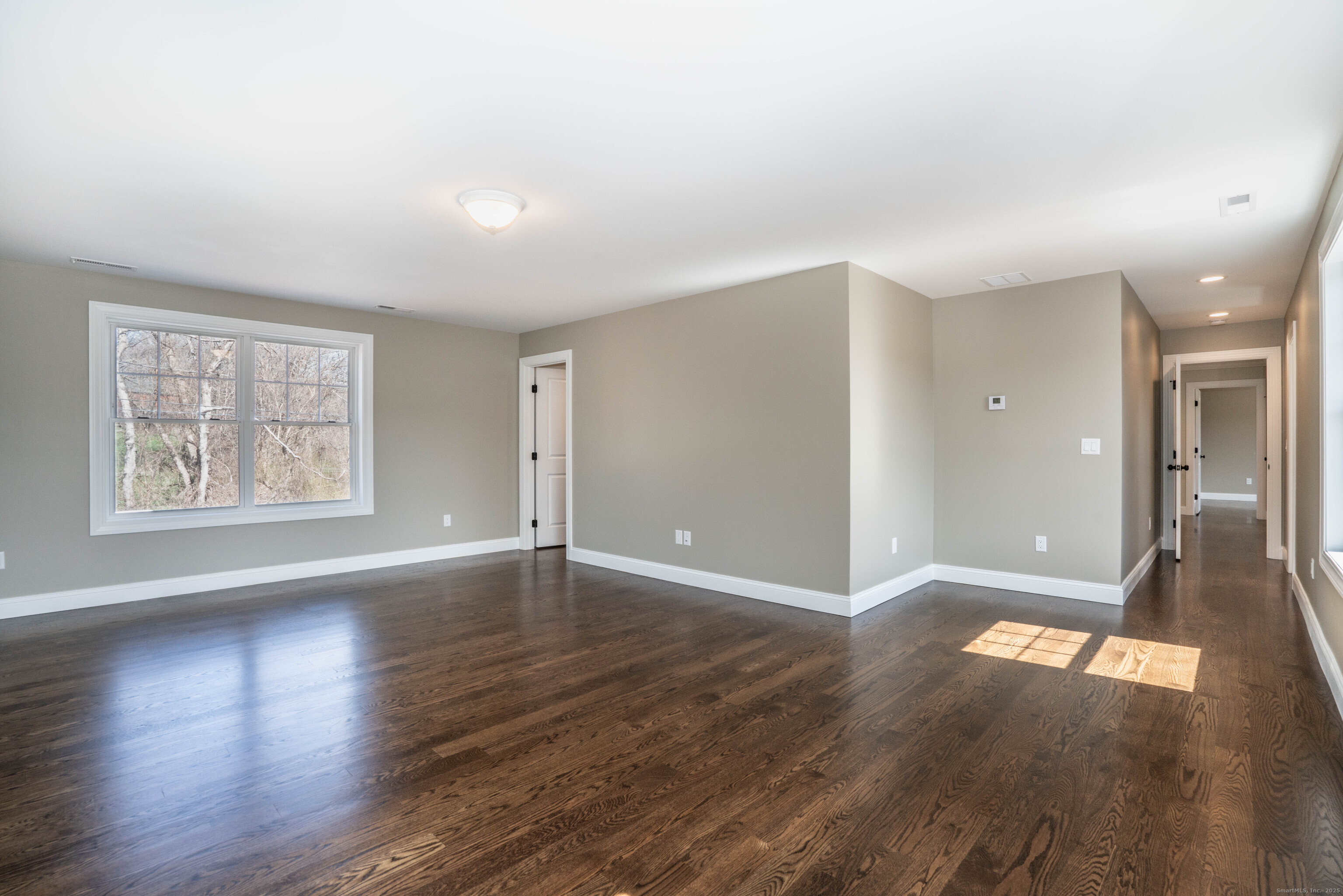 975 High Road Berlin, CT 06037 - Photo 34 of 35 an empty room with wooden floor and windows
