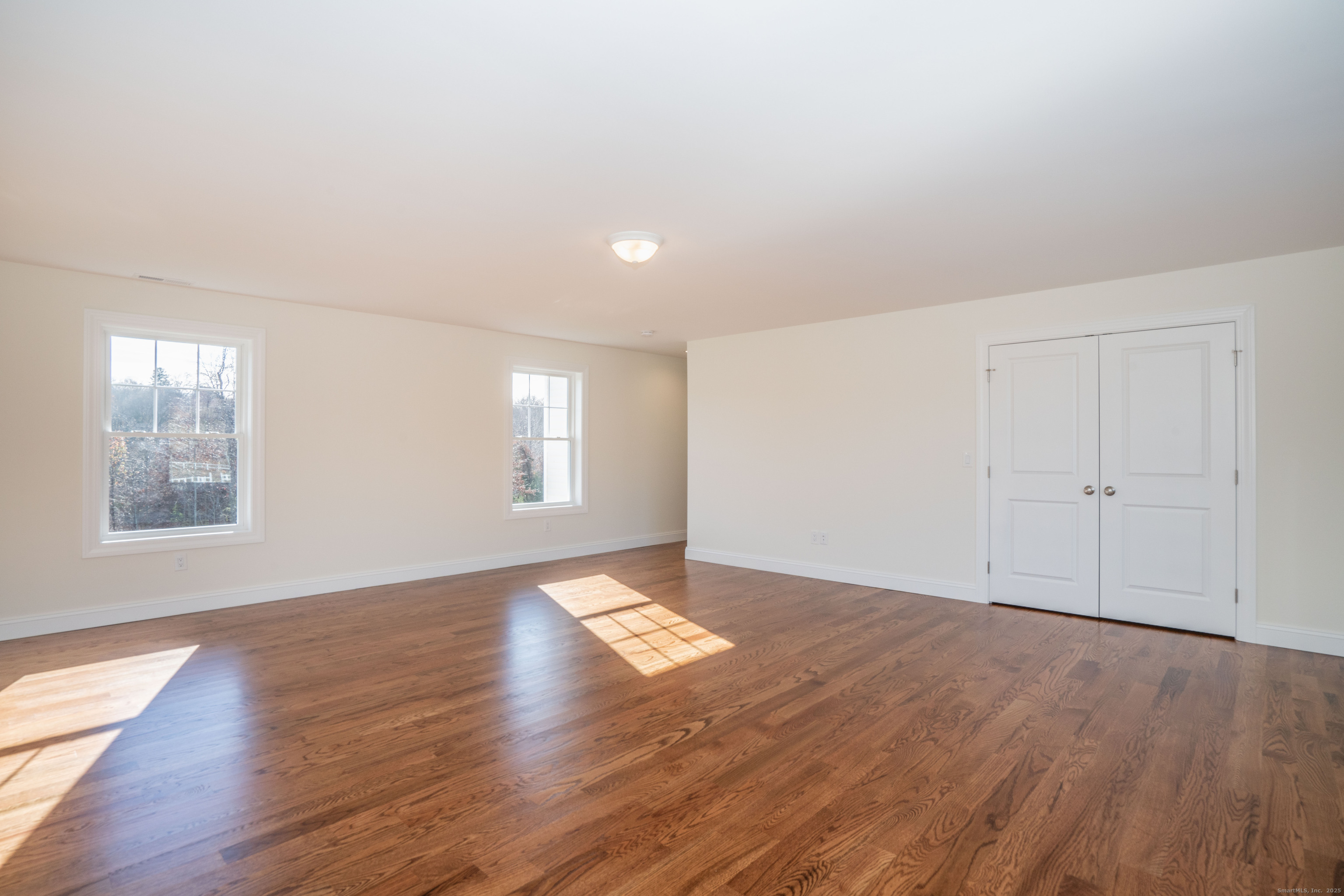 975 High Road Berlin, CT 06037 - Photo 5 of 35 a view of an empty room with wooden floor and a window