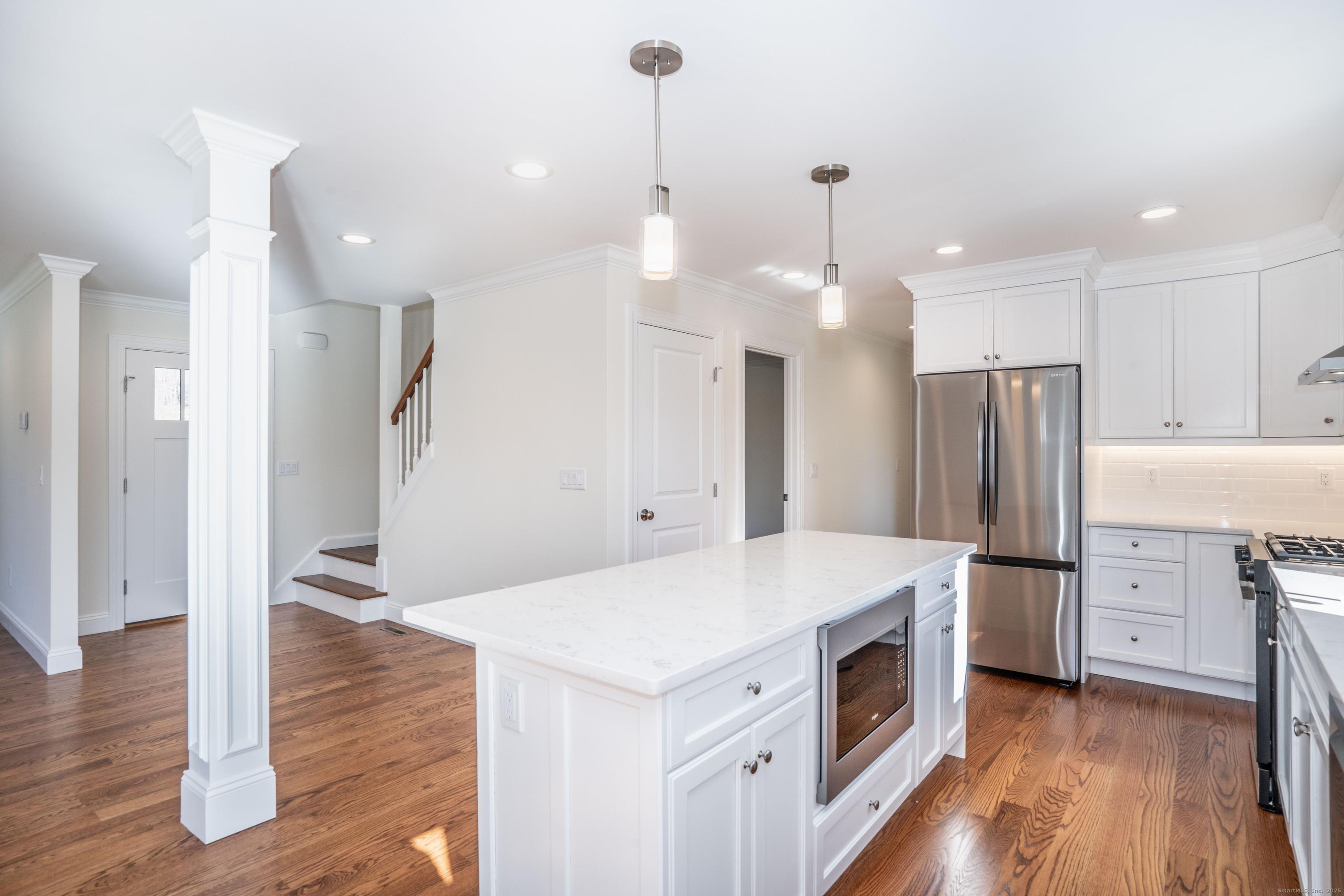 975 High Road Berlin, CT 06037 - Photo 10 of 34 a kitchen with a stove a refrigerator and a fireplace