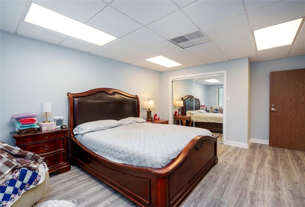 34150 Stowe Road Winchester, CA 92545 - Photo 57 of 80 a bedroom with bed and wooden floor