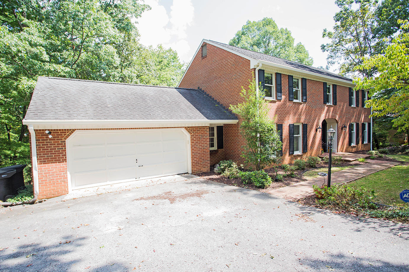 5135 Falcon Ridge Road Roanoke, VA 24018 - Photo 1 of 56 a view of a house with backyard and trees