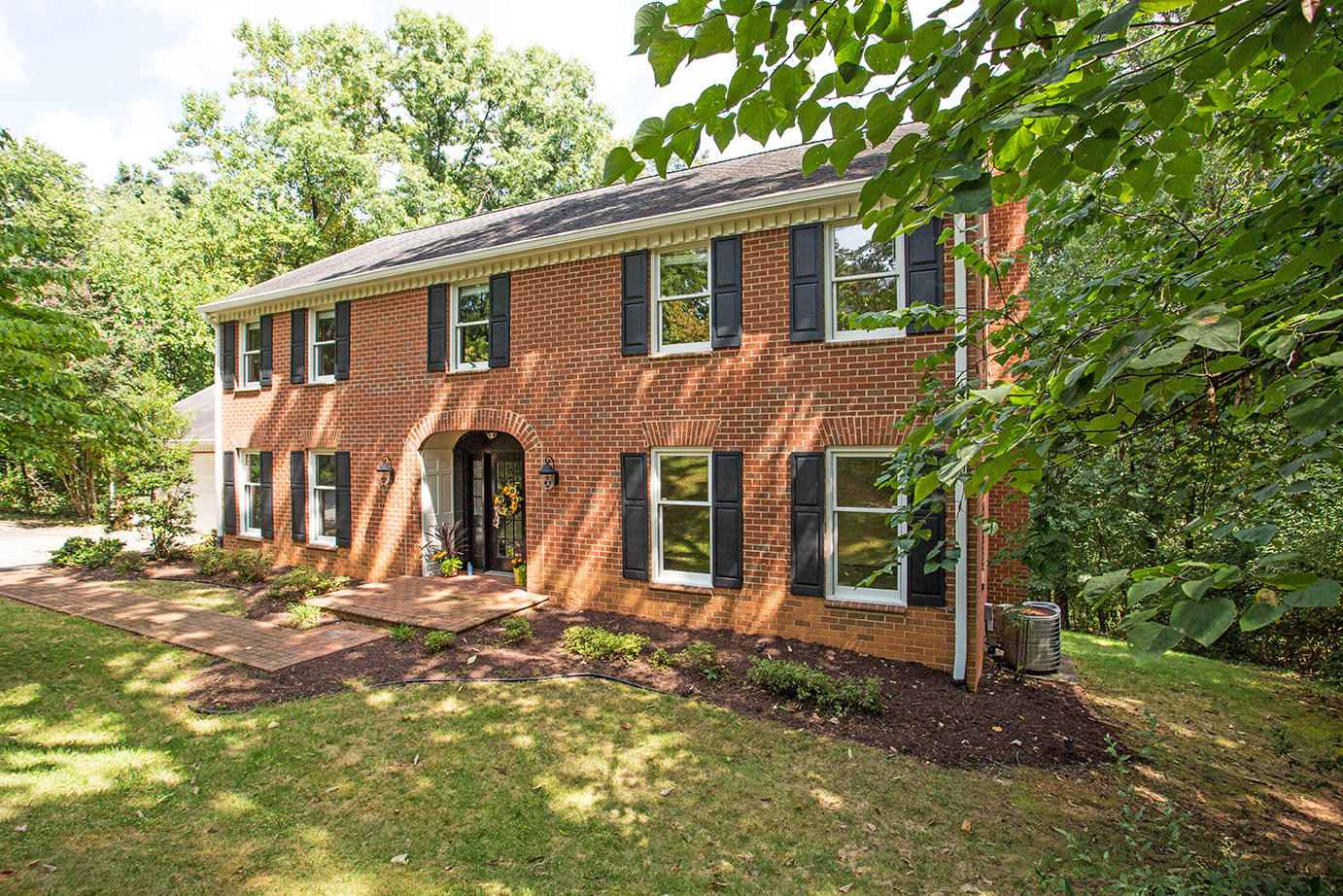 5135 Falcon Ridge Road Roanoke, VA 24018 - Photo 2 of 56 a front view of a house with garden
