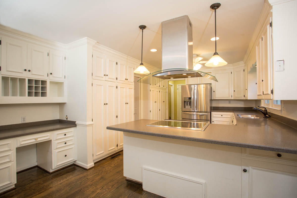 5135 Falcon Ridge Road Roanoke, VA 24018 - Photo 15 of 56 a kitchen with stainless steel appliances granite countertop a stove a sink and a wooden floors