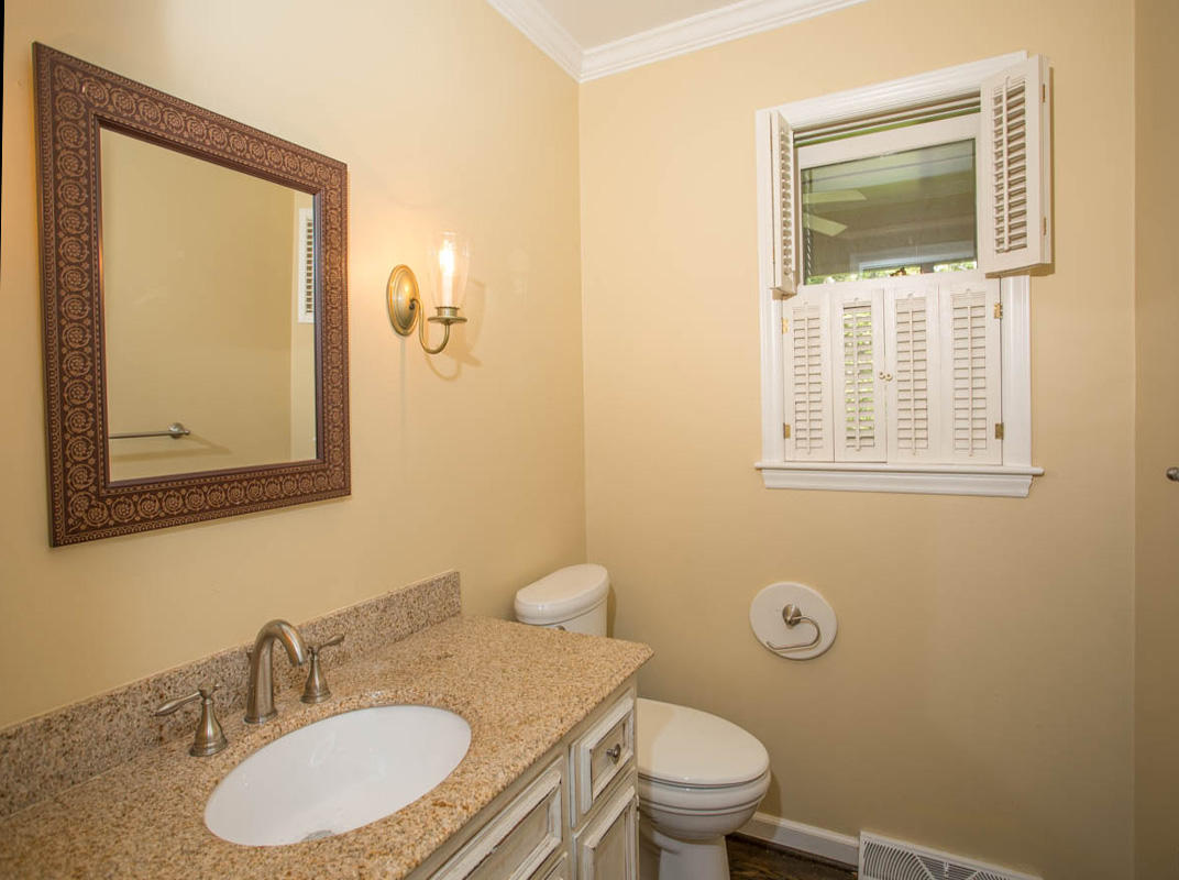5135 Falcon Ridge Road Roanoke, VA 24018 - Photo 16 of 56 a bathroom with a granite countertop sink toilet and mirror