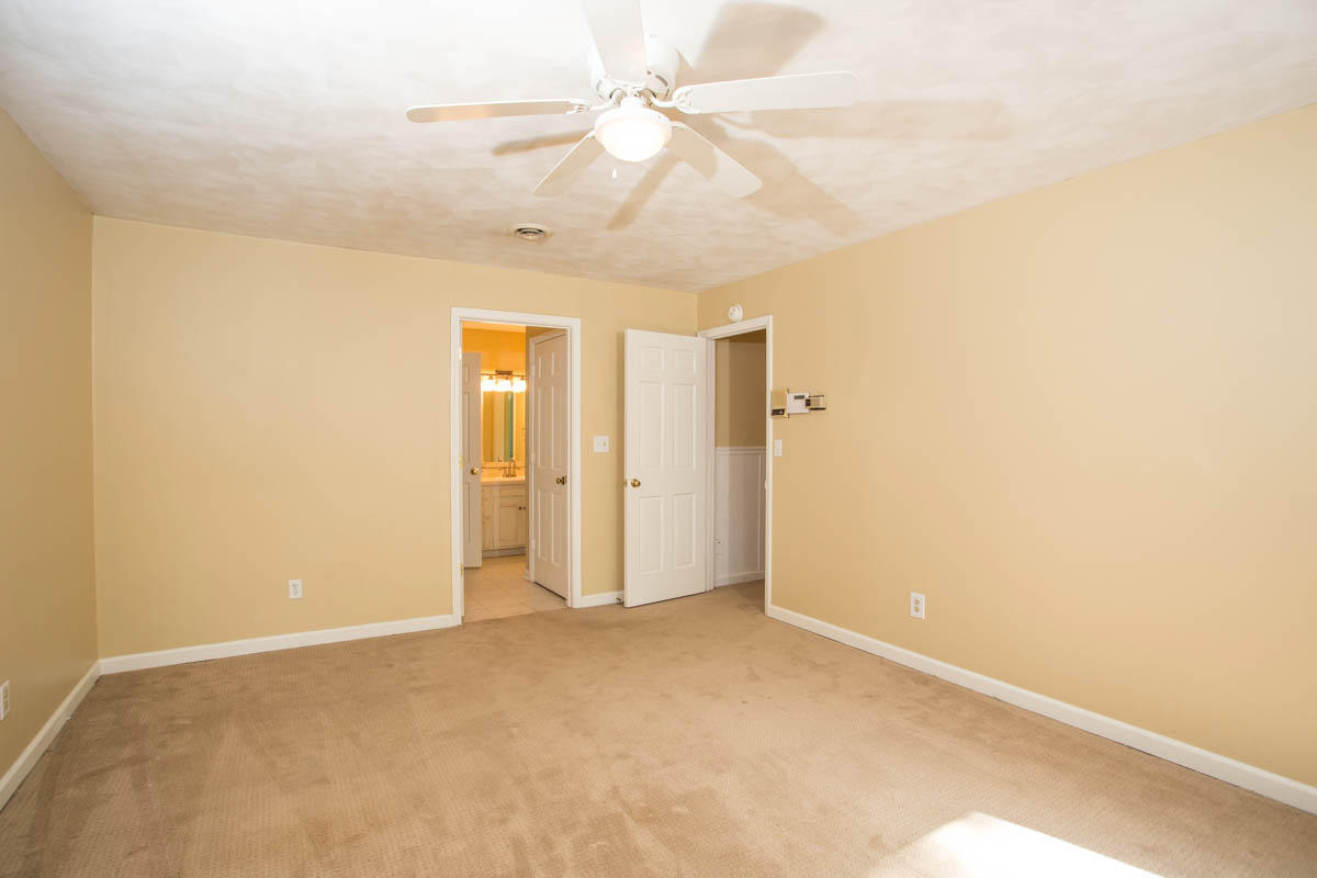 5135 Falcon Ridge Road Roanoke, VA 24018 - Photo 30 of 56 an empty room with a ceiling fan and a window