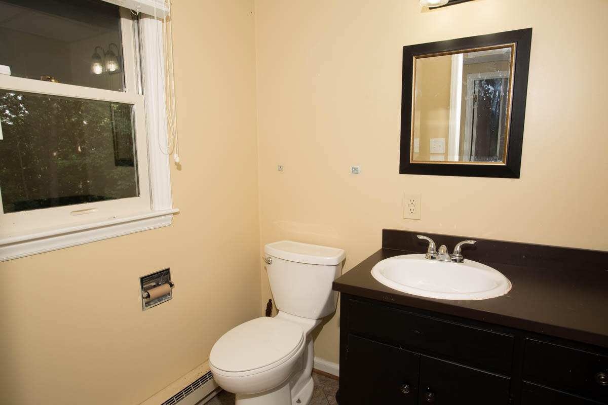 5135 Falcon Ridge Road Roanoke, VA 24018 - Photo 38 of 56 a bathroom with a sink a toilet and mirror