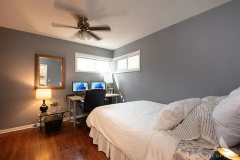 a bedroom with a bed and a table