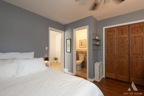 a bedroom with a bed and a shower