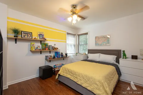 a bed room with a bed and a chandelier