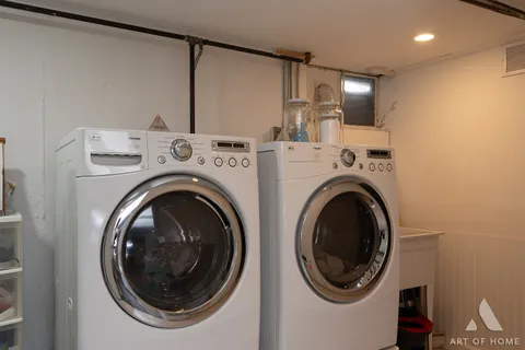 a view of a hallway with washer and dryer