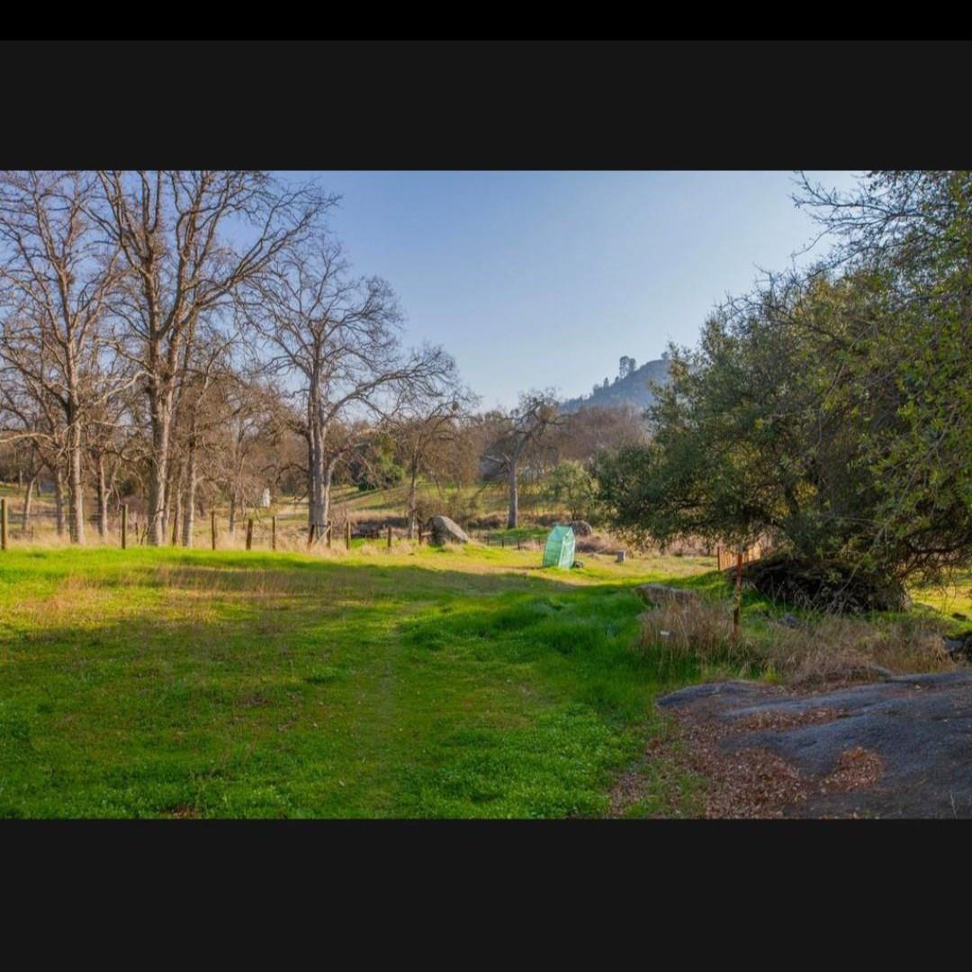 33831 Medford Road Auberry, CA 93602 - Photo 28 of 28 a view of a golf course with a lake