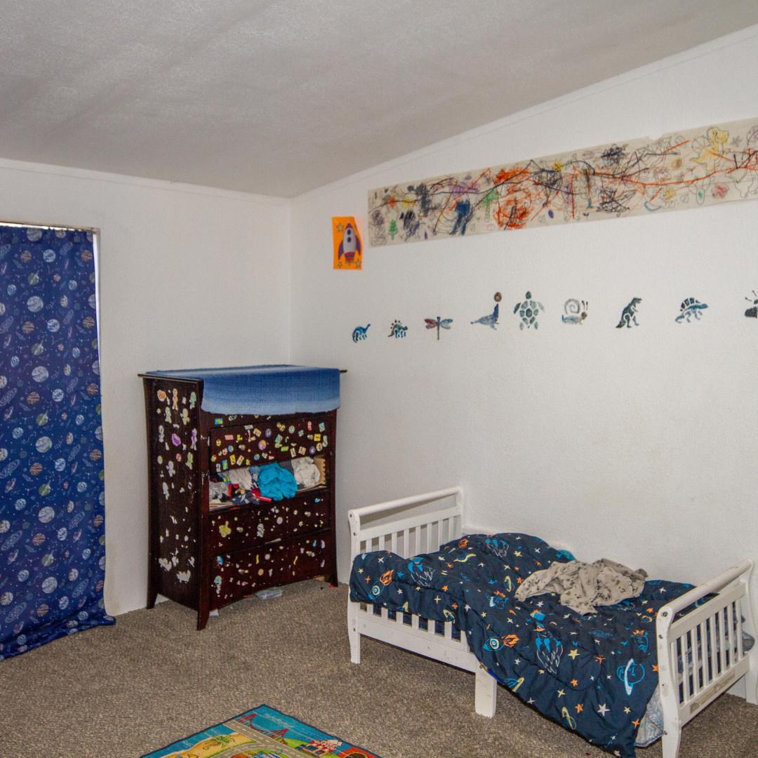 33831 Medford Road Auberry, CA 93602 - Photo 4 of 28 a bedroom with a bed and a window