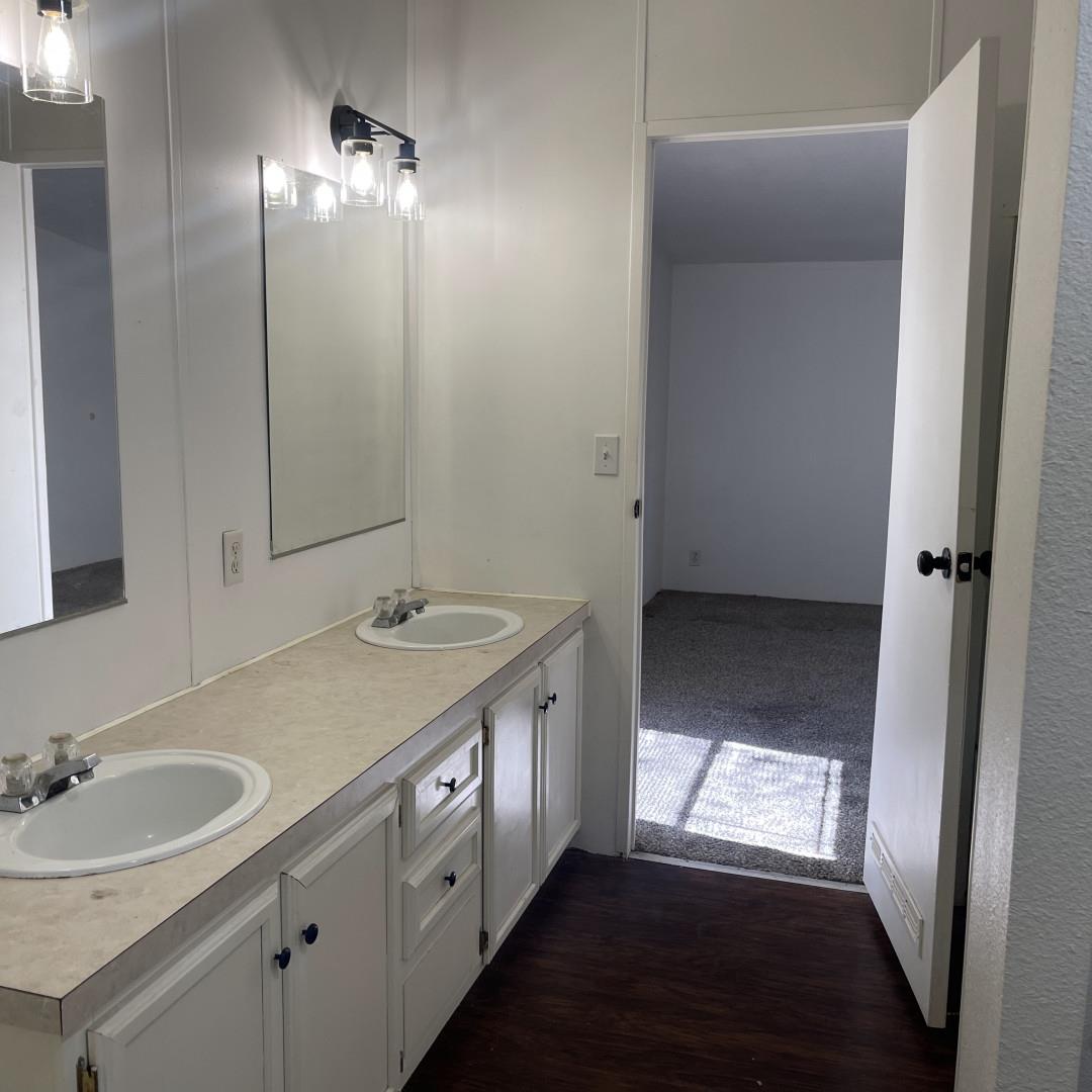 33831 Medford Road Auberry, CA 93602 - Photo 4 of 35 a bathroom with a sink a vanity and a mirror