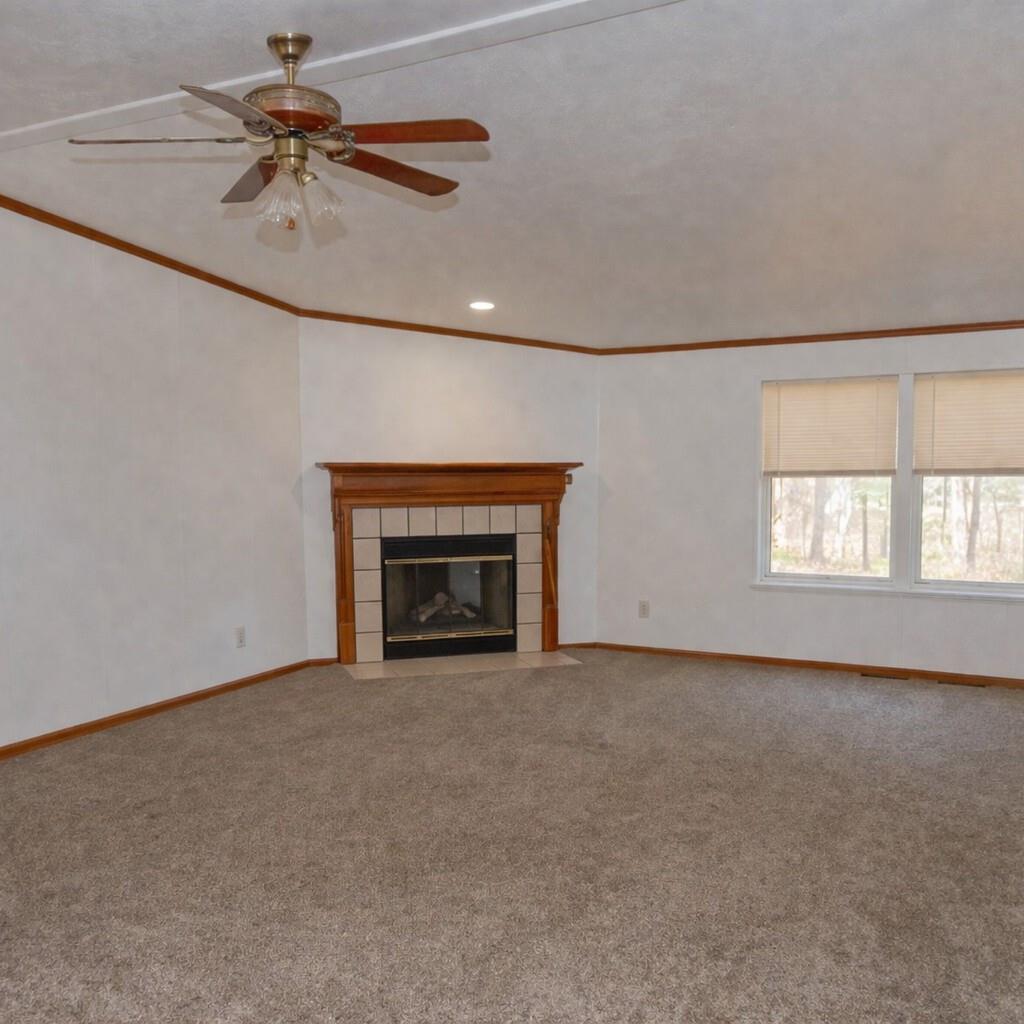 33831 Medford Road Auberry, CA 93602 - Photo 7 of 35 an empty room with windows and fan