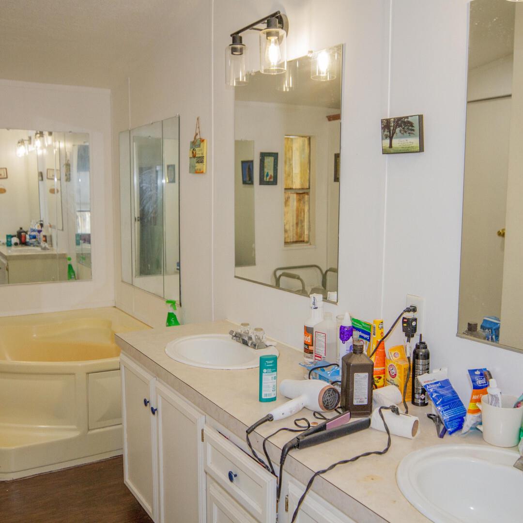 33831 Medford Road Auberry, CA 93602 - Photo 7 of 28 a bathroom with a sink mirror and a bathtub
