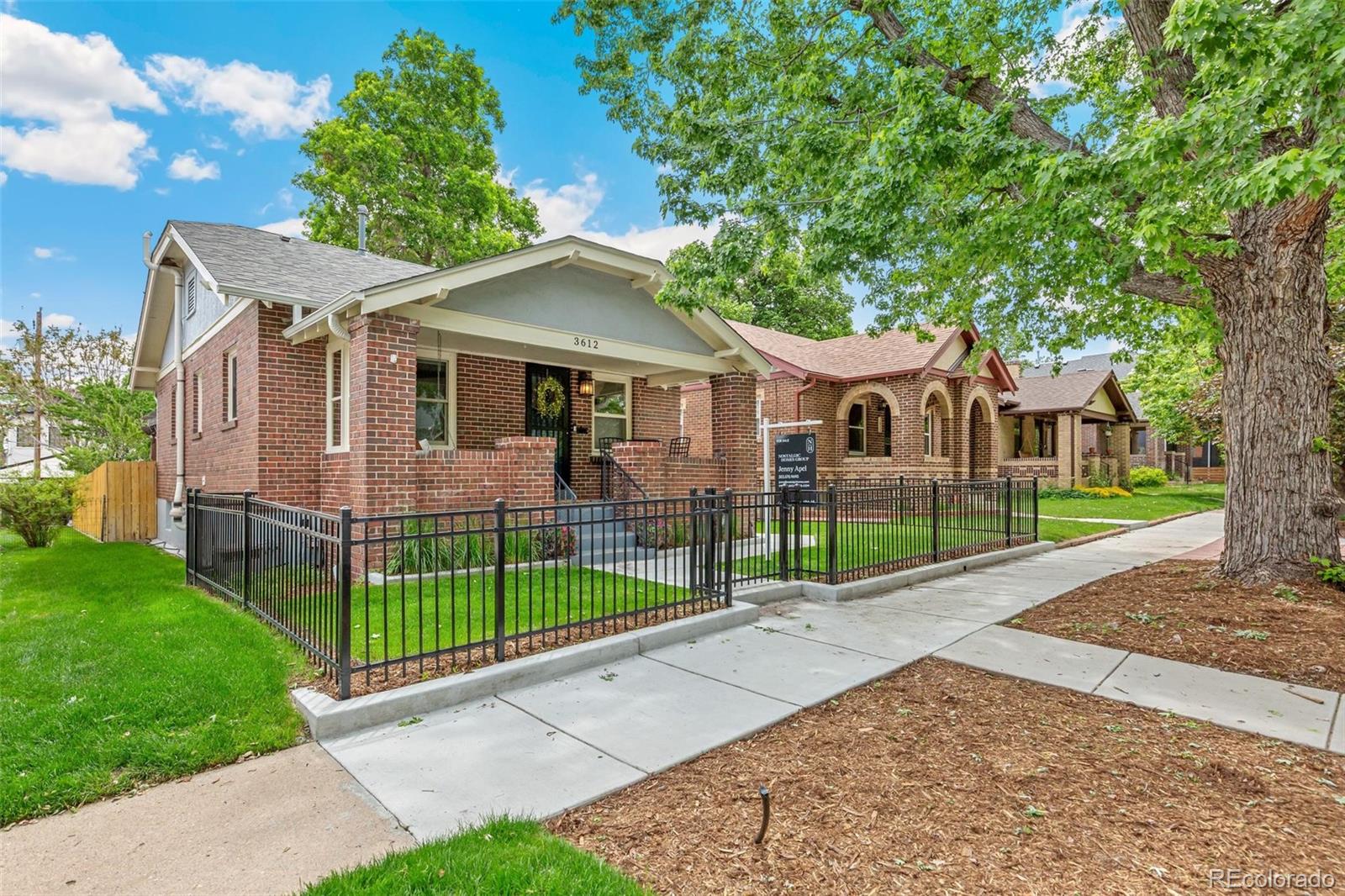 3612 Perry Street Denver, CO 80212 - Photo 1 of 50 a view of a white house with a big yard and potted plants
