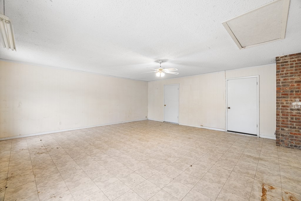168 Stoney Hills Road Center Point, TX 78010 - Photo 20 of 32 an empty room with chandelier fan