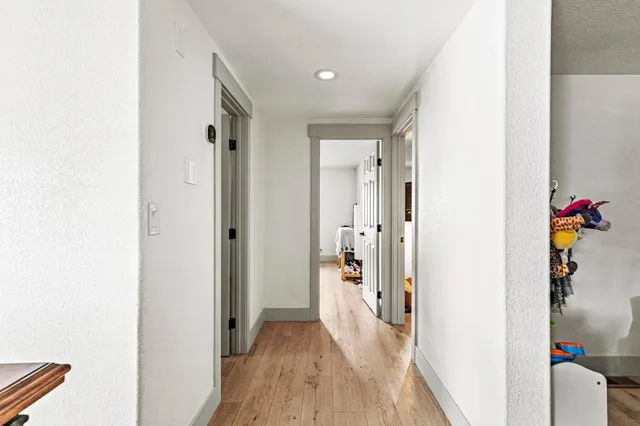 a room with toys and wooden floor