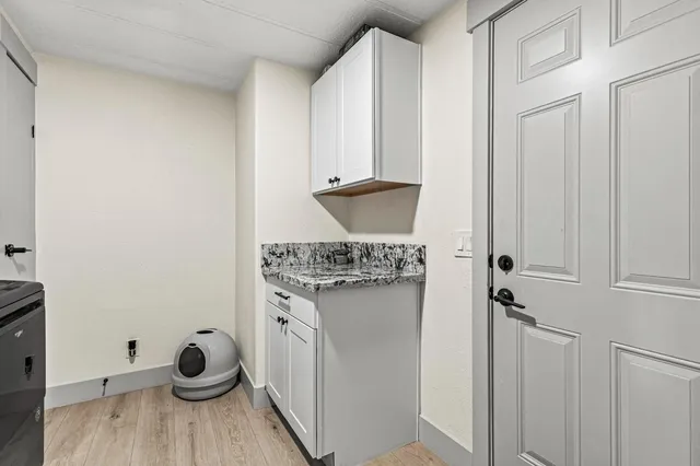 a kitchen with stainless steel appliances kitchen island granite countertop a stove a sink and a refrigerator