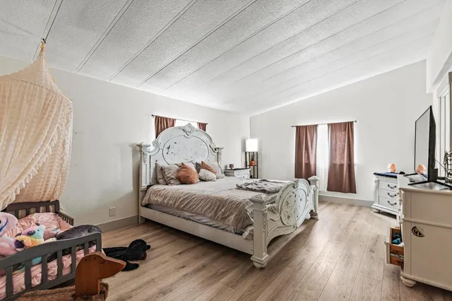 a bedroom with a bed and a closet