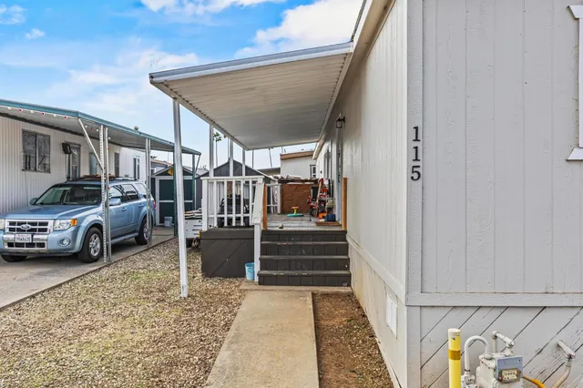 a group of people sitting in front of retail shop