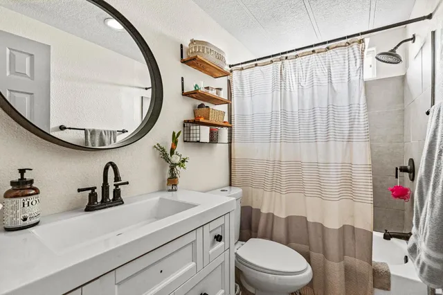 a view of a hallway with wooden floor and entryway