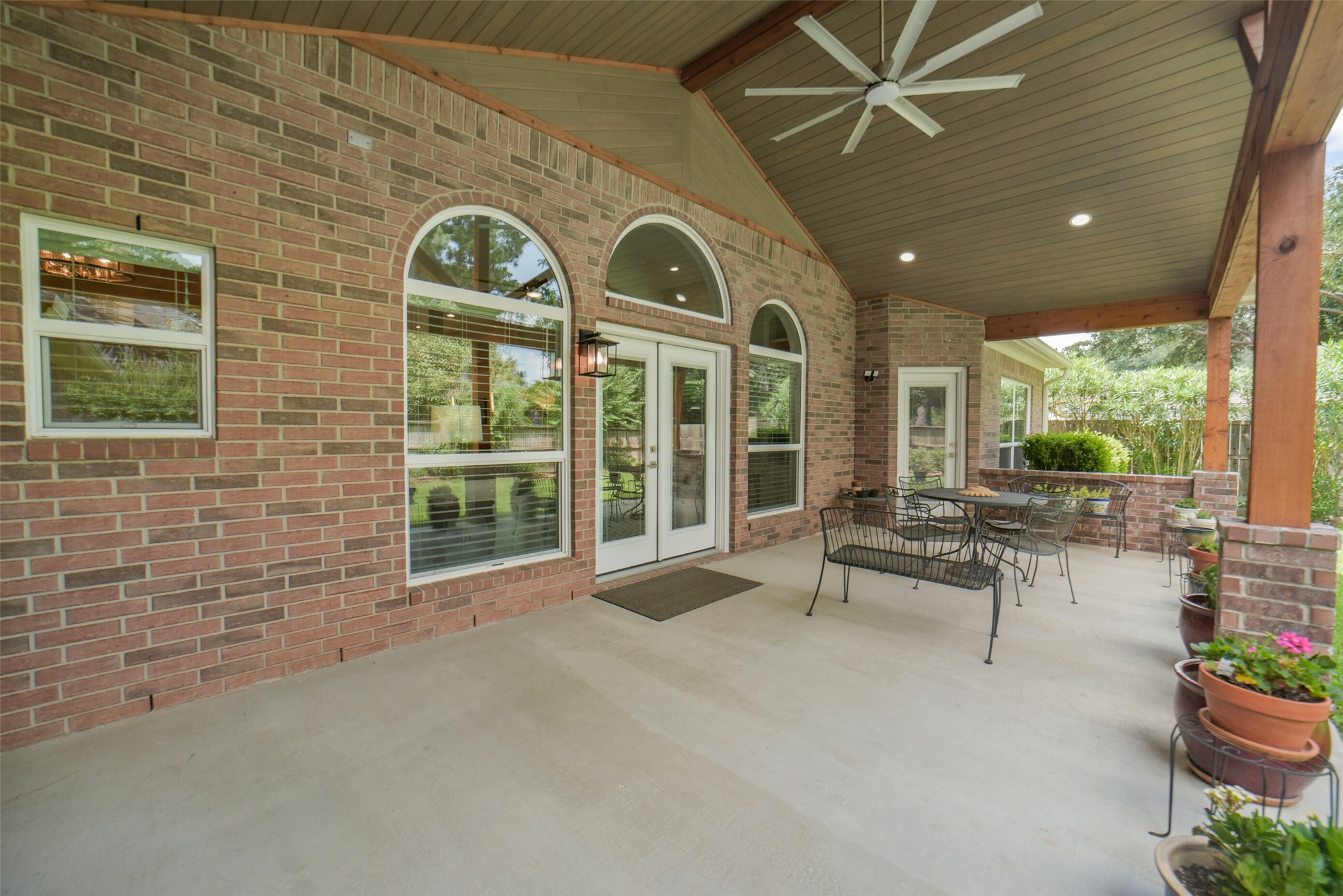 1310 Lambourne Circle Spring, TX 77379 - Photo 42 of 50 Approximately 28' x 12.5, Cedar beamed covered patio with LED lights and smart fan