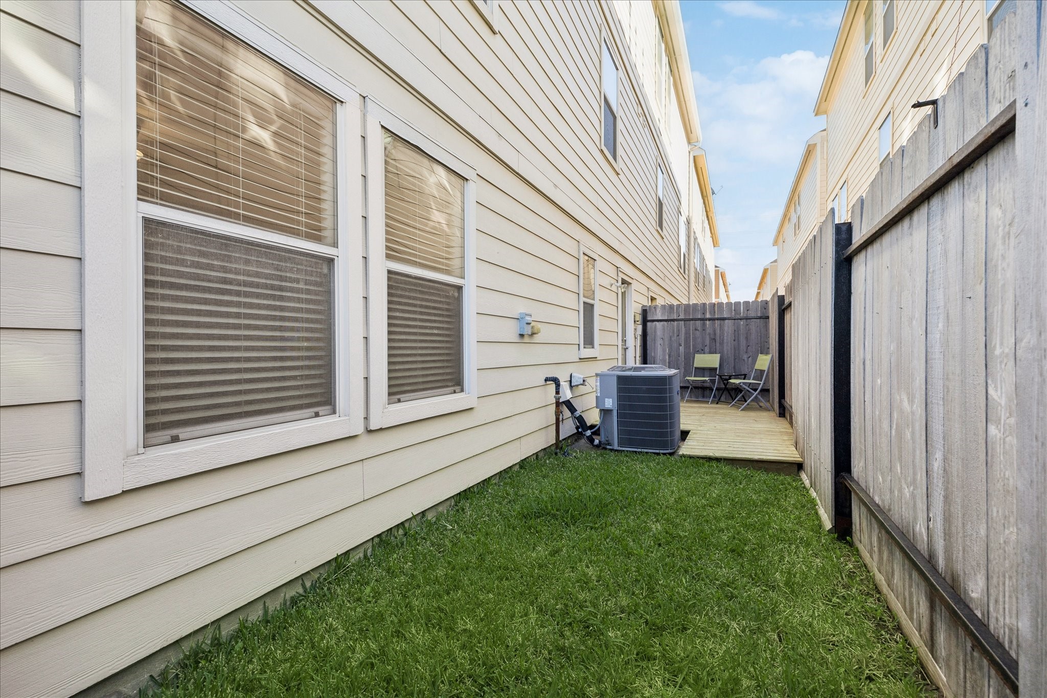 3332 Masters Point Drive Houston, TX 77091 - Photo 4 of 21 a backyard of a house with table and chairs