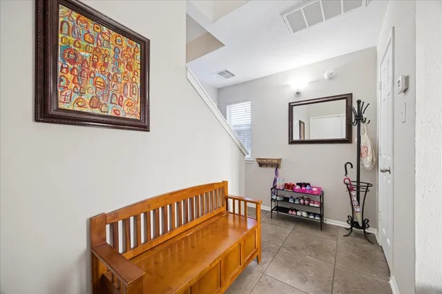 a view of room with stairs and a couch
