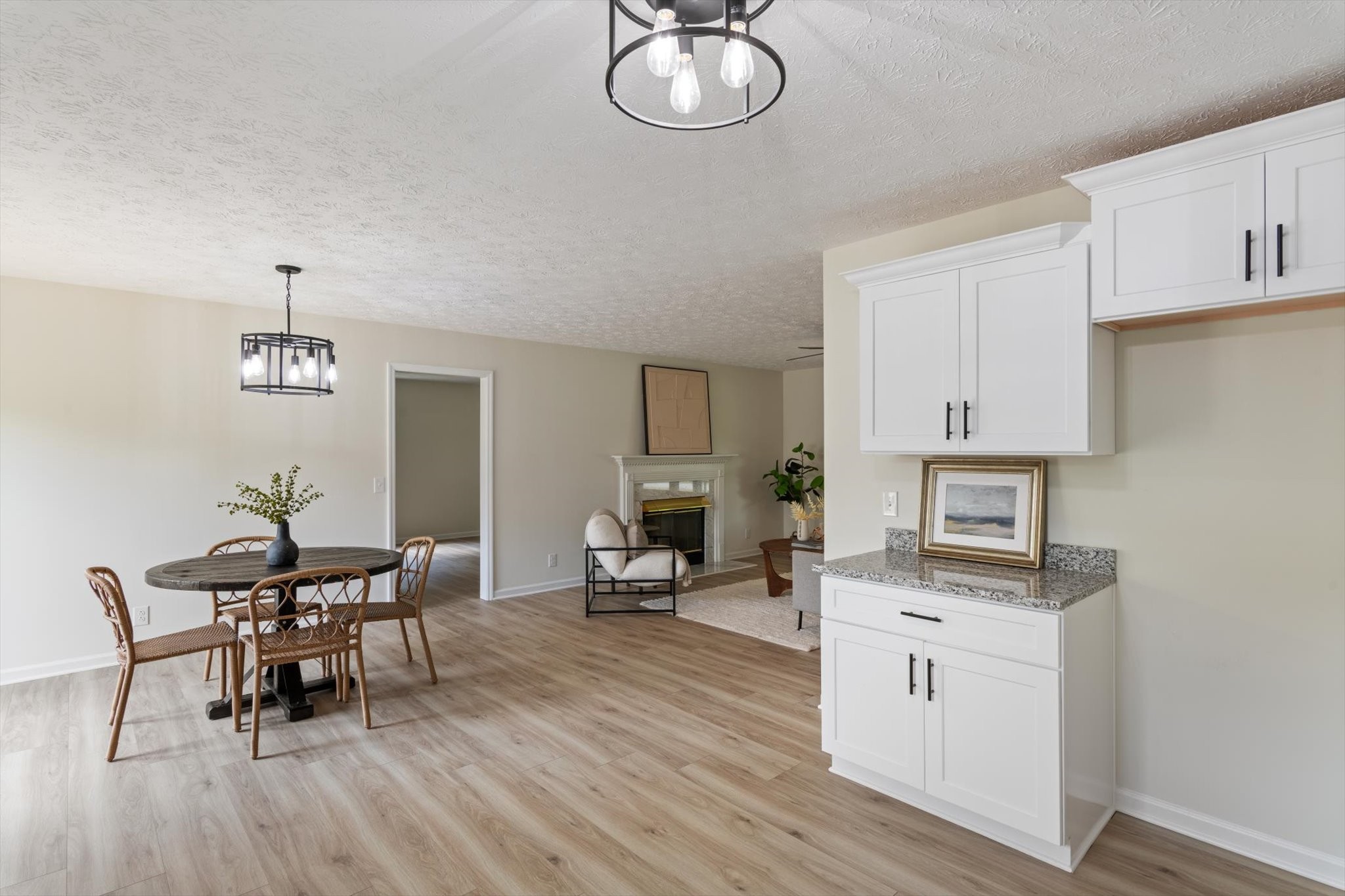3671 Apache Trail Springfield, TN 37172 - Photo 11 of 28 a view of dining room and kitchen with furniture wooden floor and a chandelier