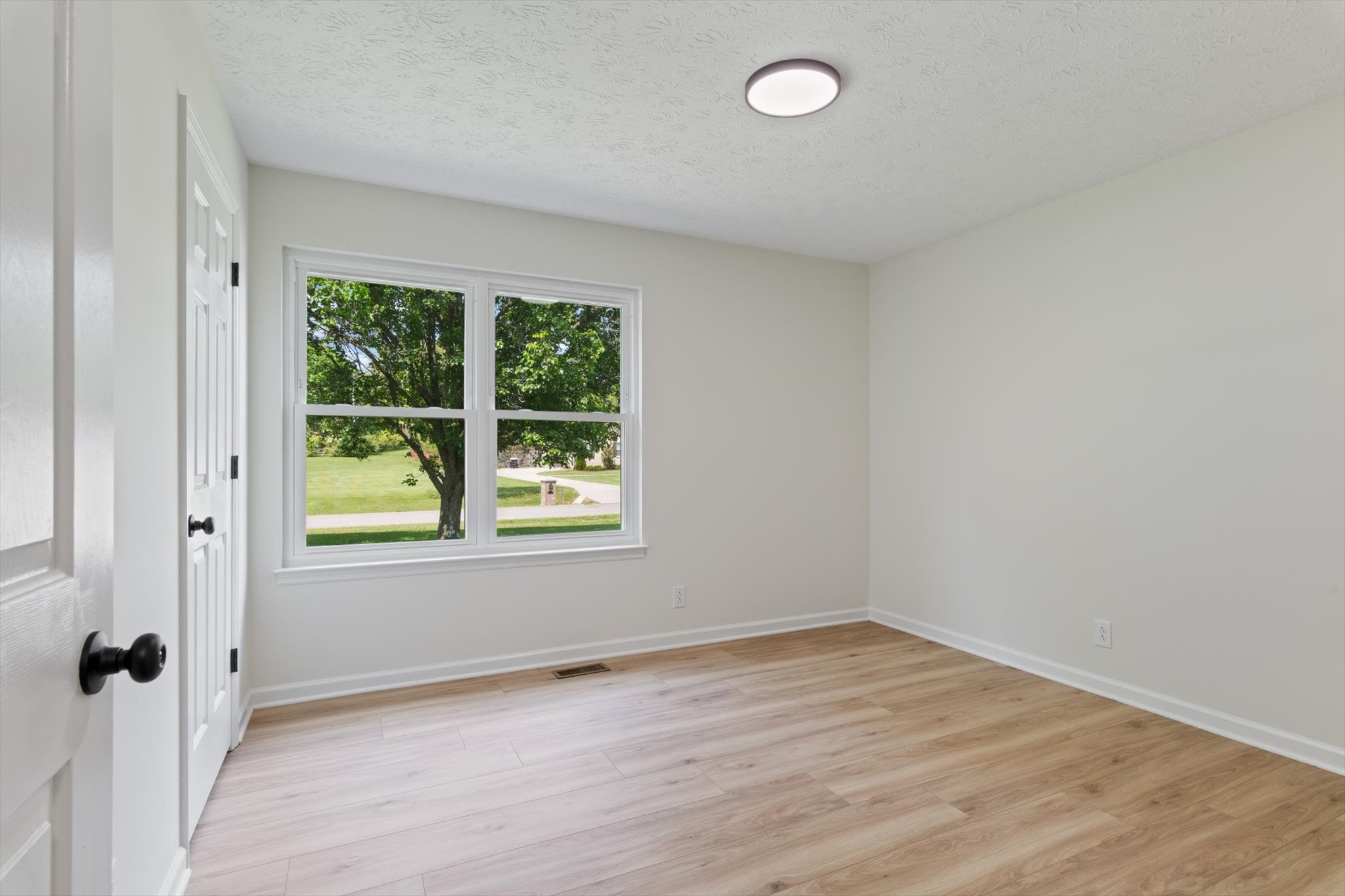 3671 Apache Trail Springfield, TN 37172 - Photo 15 of 28 an empty room with wooden floor and windows