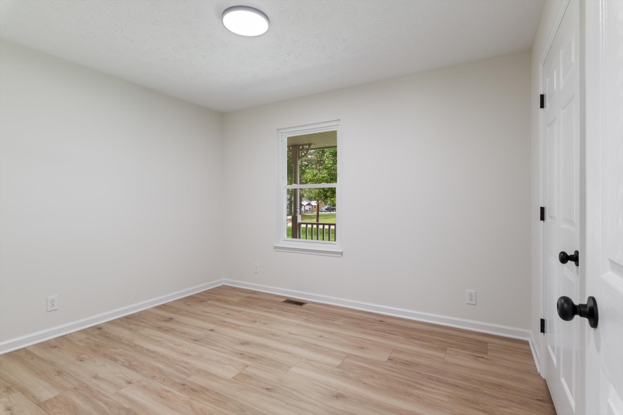 3671 Apache Trail Springfield, TN 37172 - Photo 17 of 28 a view of an empty room with wooden floor and a window
