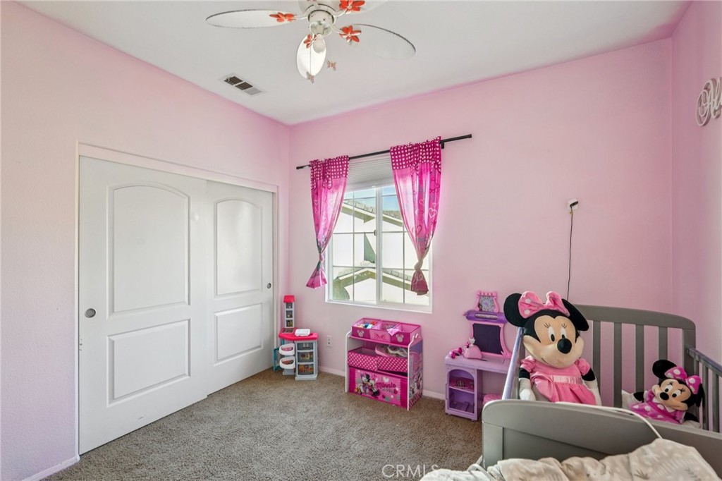 264 CLEOMELLA Court Hemet, CA 92543 - Photo 12 of 31 a bedroom with furniture and a chandelier